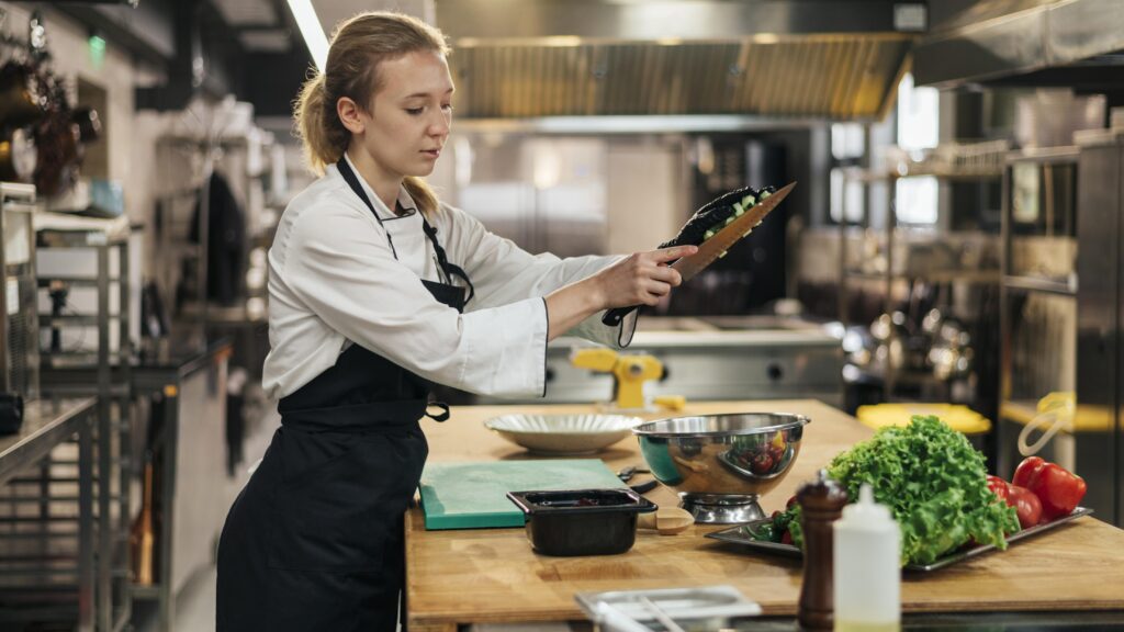 Side View Female Chef With Apron Cooking Kitchen 1024x576